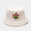 Macro detail of leaf embroidery and reinforced stitching on off-white canvas bucket hat - Beige