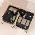 Black travel luggage organizer set including numbered mesh zipper packing cubes in a suitcase - Black 7-Piece Set