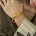 Bracciale Tubogas 10mm in acciaio al titanio dorato con design a strisce vintage - Larghezza 1cm/Diametro interno 5,5cm / Oro