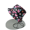 Close-up of black fisherman hat with cute strawberry print on a metal stand - M (56-58cm) / Black