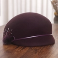 Detailed view of dark purple wool cloche hat with hand-sewn beads and mink fur pompom - M (56-58cm) / Purple