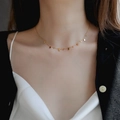 Elegant gold titanium steel choker necklace featuring delicate rectangular charms on a model - Rectangular Fringe Necklace (8810) / Gold