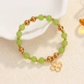 Green natural stone stretch bracelet with gold beads and a lucky clover charm - Green Beads-Gold Clover Charm