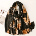 Elegant black long scarf with gold foil leaf print and delicate tassels on cream background - Black