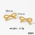 Detail shot of golden bow earrings with zircon stones, measuring 22mm by 11mm - Gold Earrings (D2841)