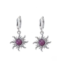 Close-up of silver sun-shaped stud earrings with purple gemstone and zircon accents - Earrings - Silver