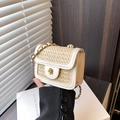 Mini flap woven straw crossbody bag with cream leather trim and golden flower lock - White