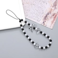 Beaded phone charm featuring black and white beads with a polka dot bow and heart charm - Spotted Heart Bowknot (K2907)