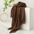 Deep brown cotton linen scarf with elegant fringe draped on a minimalist white stand - Brown