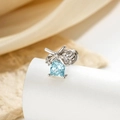 Silver bow stud earring featuring a square light blue gemstone and small diamonds - Light Blue (Single)