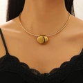 Gold-plated snake chain necklace with an oval metal pendant on a model's neck - 18k Gold Pebble Necklace (3854)