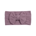 Detail of baby nylon headband with a large cable knit bow in dusty rose purple color - New Taro Purple