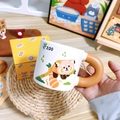 Ceramic panda coffee mug with orange ring handle and cute zoo animal illustration - Raccoon