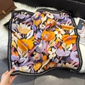 Detailed close-up of floral print square scarf with purple and orange blossoms on black - Orange Purple (W-473-Orange Purple)