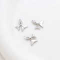 Macro view of silver mermaid tail pendants with sparkling zircon and pavé crystals - 13# Silver Mermaid Tail