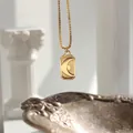18K gold plated celestial necklace featuring a crescent moon and sunray coin pendant - Moon