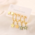 Close-up of 18K gold plated stainless steel star earring set with blue enamel details - Star Set