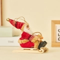 Santa Claus in red plaid plush suit sitting on a wooden sled for Christmas decor - Sled Style (Red & Brown Plaid)