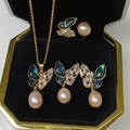 Three-piece gold butterfly jewelry set with pink pearls and iridescent wings in box - Pink