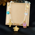 Retro beaded necklace with colorful flower and butterfly charms on a jewelry box - Multi-pendant Sun Flower Butterfly Note Style (N3772)