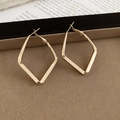 Minimalist gold geometric rhombus hoop earrings displayed on a brown velvet jewelry tray - Small / Gold