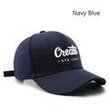 Navy blue cotton baseball cap featuring white 3D letter embroidery and adjustable strap - Adjustable / Navy Blue