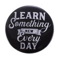 Round black enamel pin featuring 'LEARN Something NEW Every DAY' handwritten text - LEARN Something NEW Every DAY