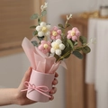 Close-up of hand-knitted pink and white crochet flower bouquet in a paper bucket - With Light + Bag / White + Pink