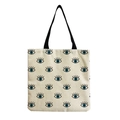 Detail of canvas tote bag featuring evil eye print and durable woven texture finish - Blue Evil Eye Pattern (hm2694)