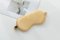 Champagne gold 22 momme silk sleep mask with elastic strap on a clean white background - Champagne Gold