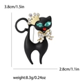 Kreative schwarze Emaille-Katzenbrosche mit goldener Krone und grünen Edelsteinaugen - Schwarz
