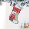 Detail eines grünen Nikolausstiefels mit Plüsch-Schneemann und Merry Christmas Holzschildchen - Schneemann