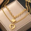 Elegant gold double layer stainless steel necklace featuring two textured heart pendants - Gold (C7247)