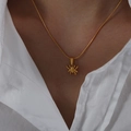 Minimalist gold-plated spider pendant necklace with fine snake chain worn on model - Spider-40+8cm