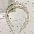 Detail of handmade pearl headbands with rhinestone accents on a soft mesh fabric background - Style C Gradient Rhinestone Pearl Headband 2-Piece Set