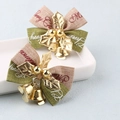 Detail of plush Christmas bows with golden bells, leaves and Merry Christmas print - Christmas Bow Series 5