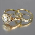 Luxury gold plated two-piece ring set featuring round solitaire and curved diamond bands - US 5 / Gold