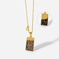 Macro detail of gold Sagittarius zodiac pendant showing front engraving and reverse sun pattern - Sagittarius