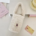 Cute white plush carry bag for water bottles with a cartoon cat patch and handle - Off-white