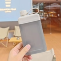 Flat square portable water bottle in translucent grey finish with an integrated handle - 450ml / Off-white