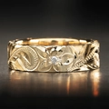 Engraved tropical flower ring in gold finish with crystal center on dark reflective surface - US 7 / Gold