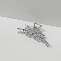 Detailed view of the silver metal spider web hair claw clip with a sleek finish - Spiderweb Hair Claw / Silver