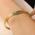 Bohemian gold plated stainless steel open bangle with oval turquoise blue center stone - Blue Stone Three-Layer Rib (2049)
