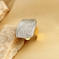 Modern two-tone stainless steel ring with wave texture on wide silver and gold band - Gold Wide Ring with Silver Wave Panel