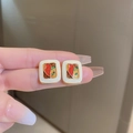 Close-up of vintage square earrings with colorful enamel inlay and golden trim finish - Colorful Pattern Enamel Square (HE11344)