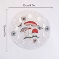 Detail of 12cm circular PVC suncatcher featuring mushroom, butterfly and moon phase designs - RPS053: Mushroom Butterfly Moon