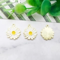 Detail of three white enamel daisy flower pendants with gold plating on marble surface - 16x18mm / White