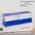 Fluid drifting bottle ornament with white sailboat and blue liquid inside acrylic case - Riding The Waves