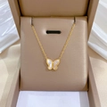 Detailed view of a gold titanium steel butterfly necklace nestled in a luxury jewelry box - Mother of Pearl Butterfly Pendant Gold (N206)