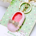 Chic pink ballet shoe keychain with sparkling rhinestones and golden metal ring - Pink Bow Shoes